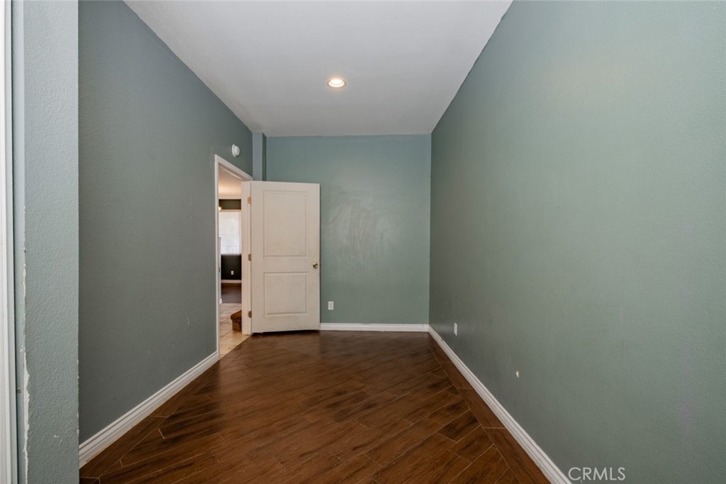 6349 Catania Court Palmdale, CA 93552 - Photo 9 of 36 an empty room with wooden floor