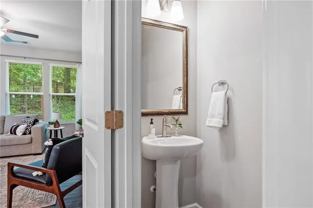 a bathroom with a sink toilet and tub