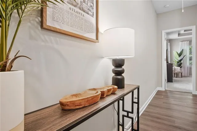 a view of a hallway with wooden floor