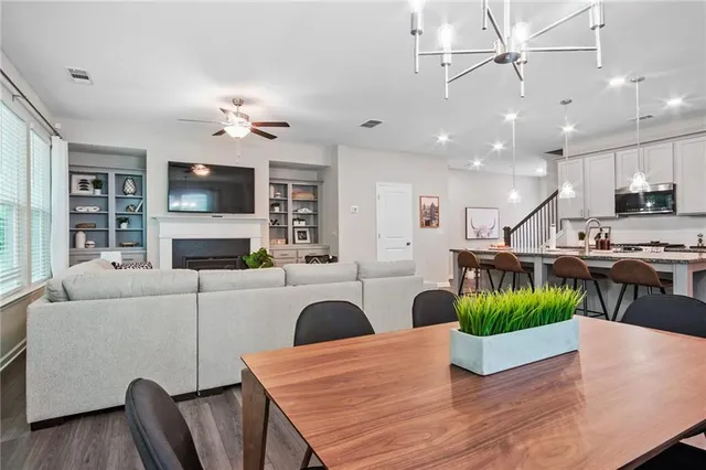 a living room with furniture fireplace and flat screen tv