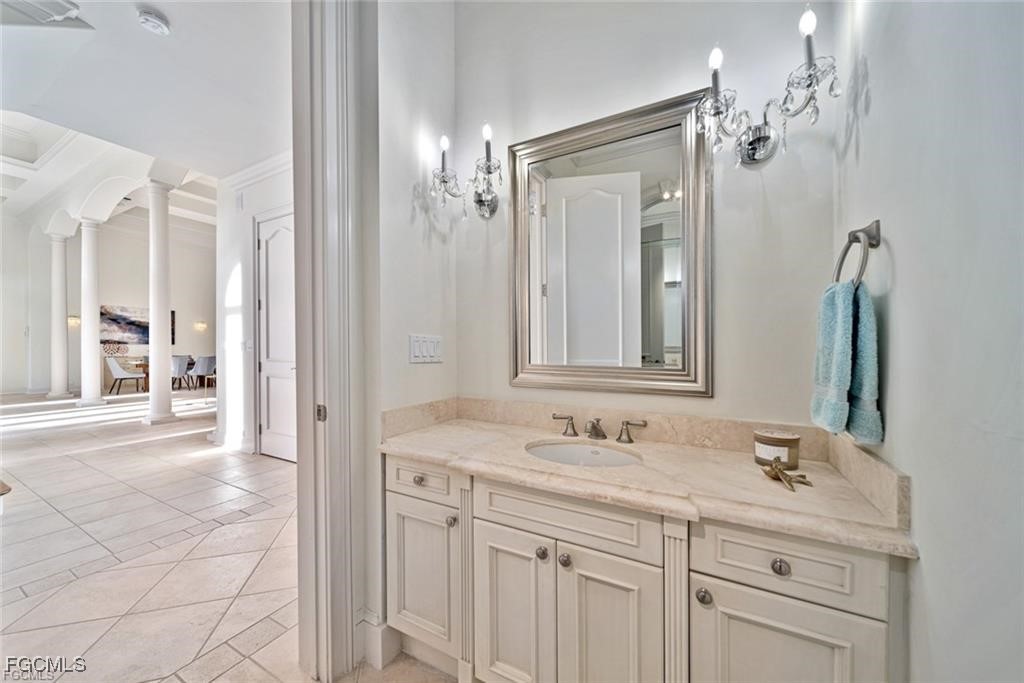 2402 Wulfert Road Sanibel, FL 33957 - Photo 37 of 47 a bathroom with a sink vanity and a mirror
