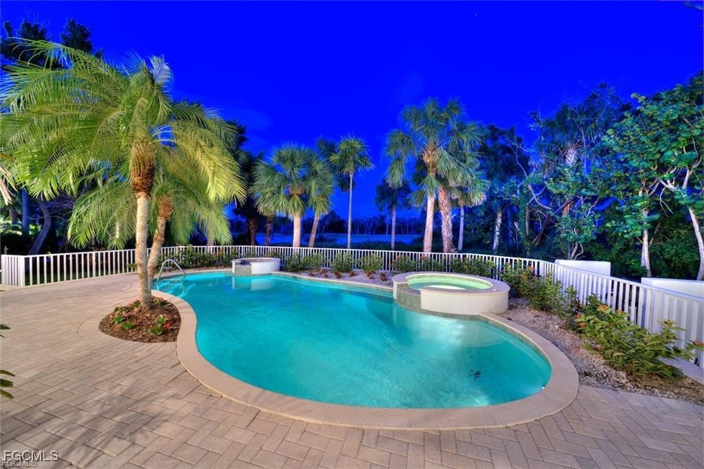 2402 Wulfert Road Sanibel, FL 33957 - Photo 42 of 47 a view of a swimming pool with a patio