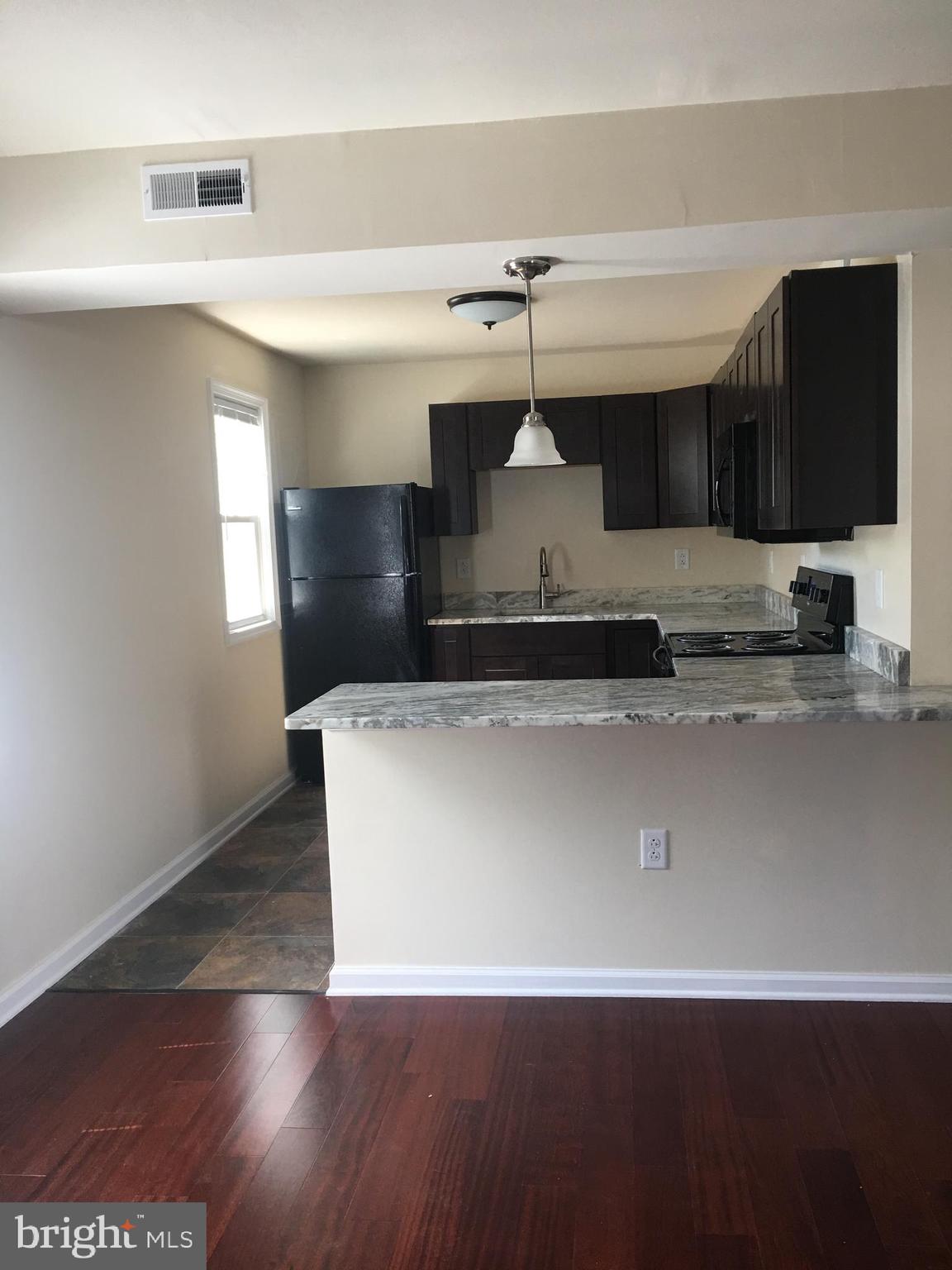 1 Pennsylvania Road, Unit 4 Glassboro, NJ 08028 - Photo 20 of 37 a view of a living room with a flat screen tv