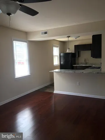 a view of kitchen with furniture and flat screen tv