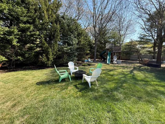 a view of a table and chairs in the garden