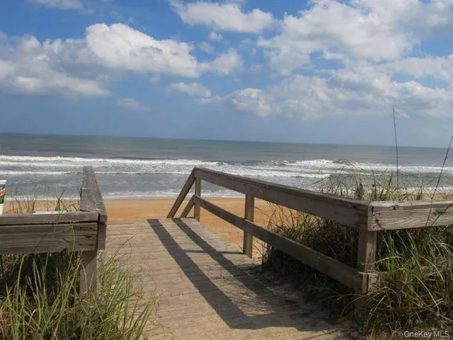 a view of swimming pool with outdoor seating