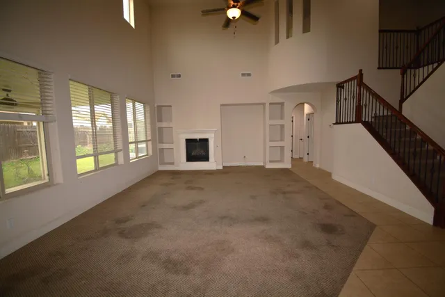 a view of empty room with windows