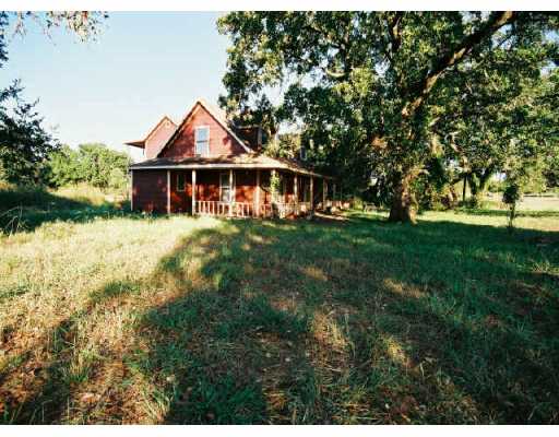 13205 Fieldstone Loop Austin, TX 78737 - Photo 1 of 1 a front view of a house with a yard