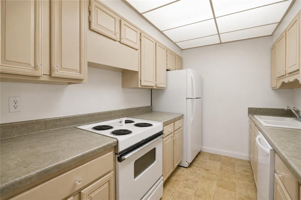 750 Washington Road, Unit 307 Pittsburgh, PA 15228 - Photo 8 of 24 a kitchen with cabinets and steel appliances