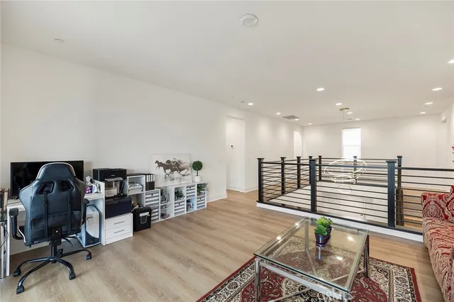 a bathroom with a large tub sink and mirror