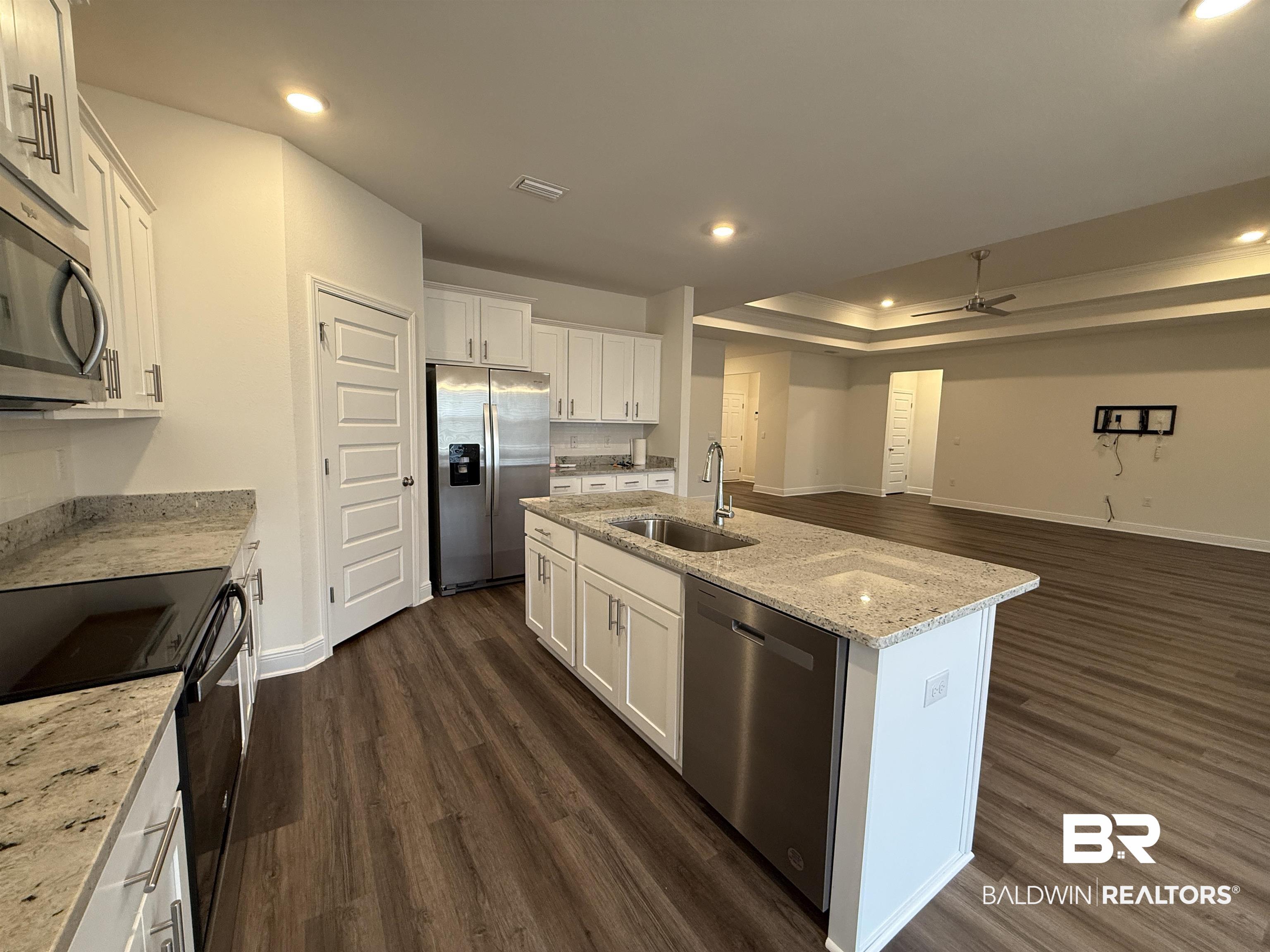 11442 Genuine Risk Circle Daphne, AL 36526 - Photo 7 of 21 Kitchen featuring white cabinetry, stainless steel appliances, light stone countertops, ceiling fan, and recessed lighting