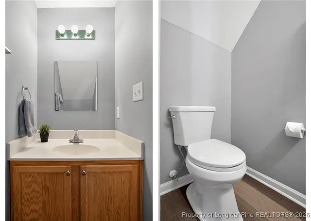 a bathroom with a sink toilet and a mirror