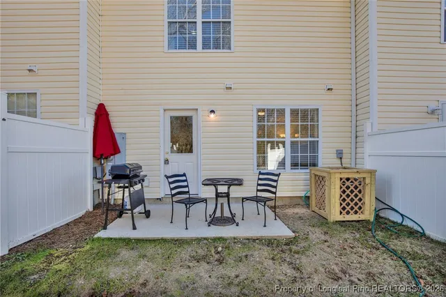 a view of table and chairs in patio
