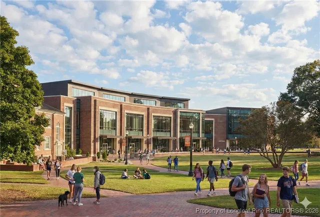 a view of a building with a backyard