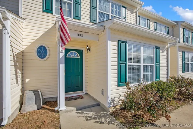a front view of a house with a porch