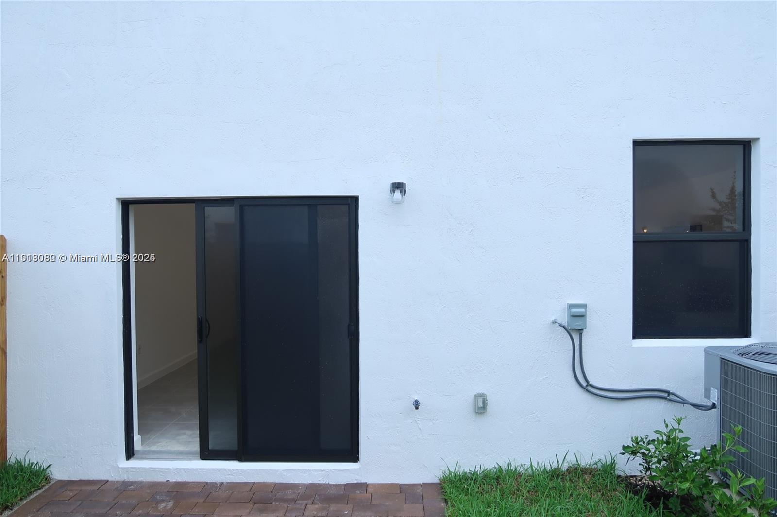 12946 Southwest 231st Street Miami, FL 33170 - Photo 12 of 42 a bathroom with a mirror and a shower