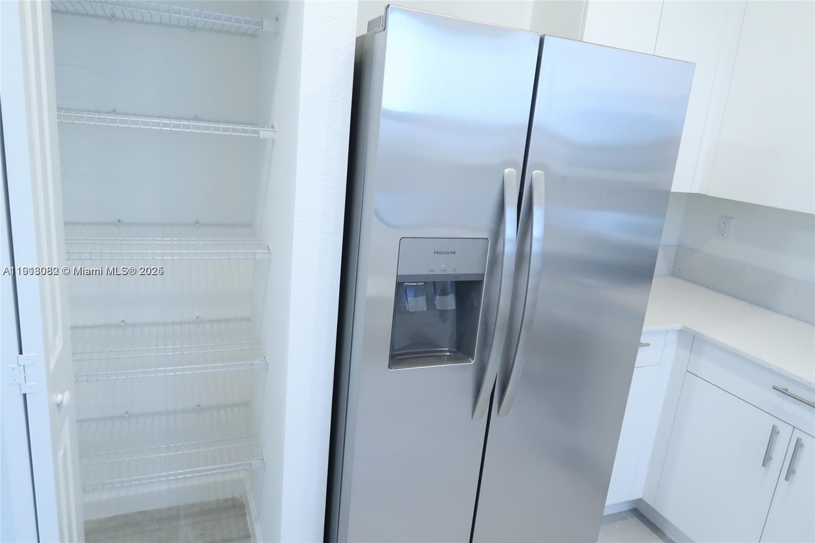12946 Southwest 231st Street Miami, FL 33170 - Photo 13 of 42 a bathroom with a glass shower door