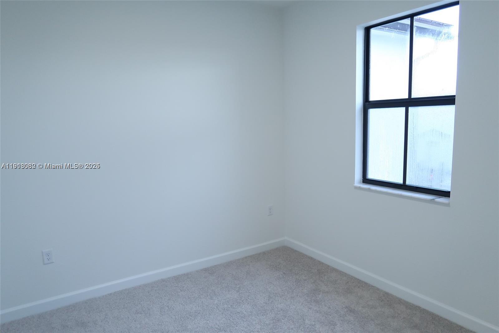 12946 Southwest 231st Street Miami, FL 33170 - Photo 24 of 42 a room that has a window