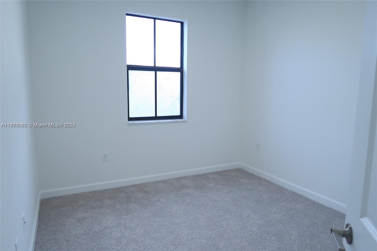 12946 Southwest 231st Street Miami, FL 33170 - Photo 26 of 42 an empty room with a window