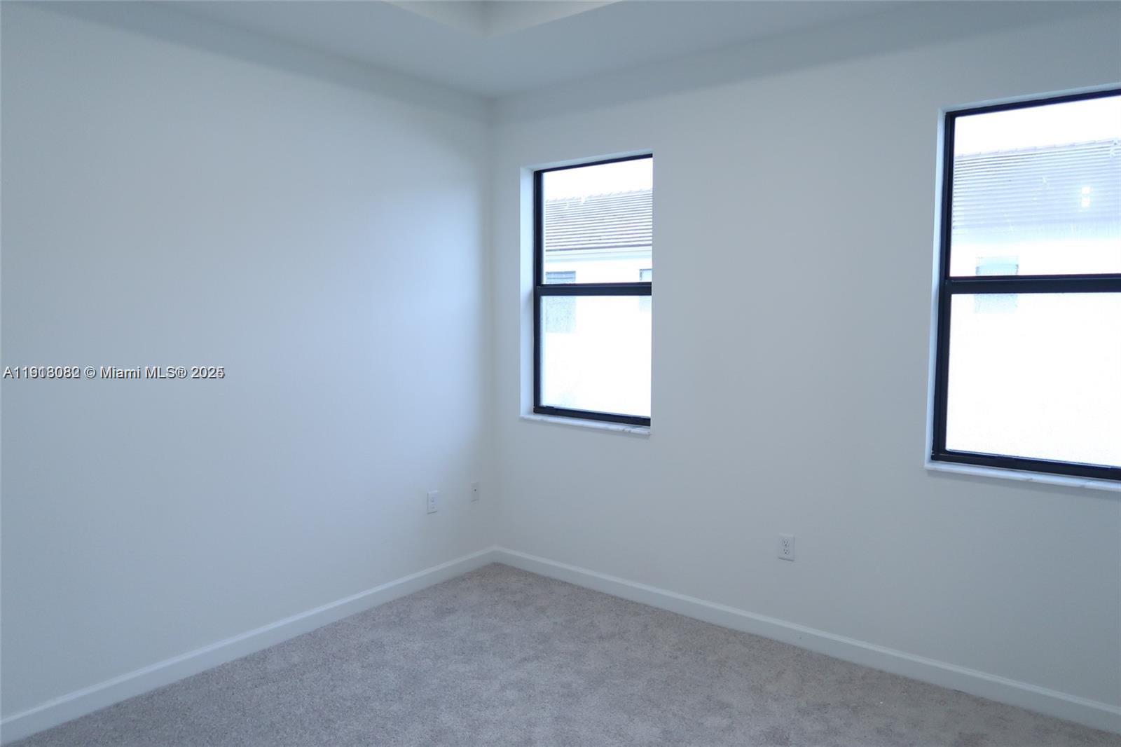 12946 Southwest 231st Street Miami, FL 33170 - Photo 33 of 42 an empty room with a window