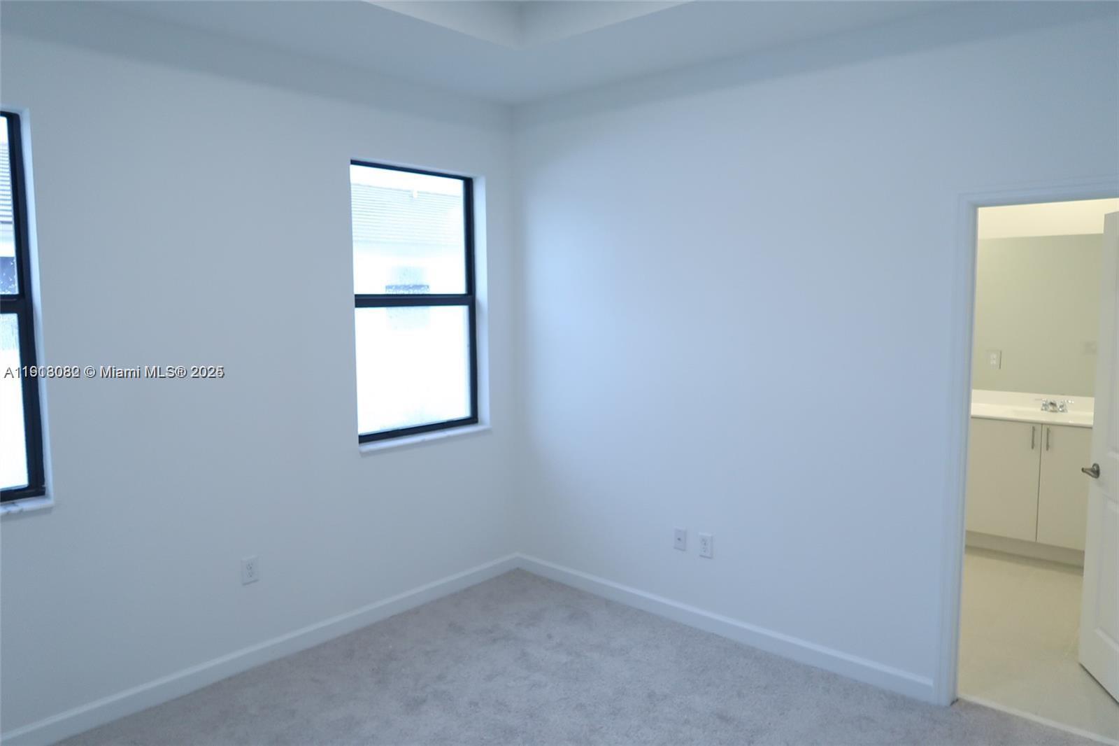 12946 Southwest 231st Street Miami, FL 33170 - Photo 34 of 42 an empty room with a window