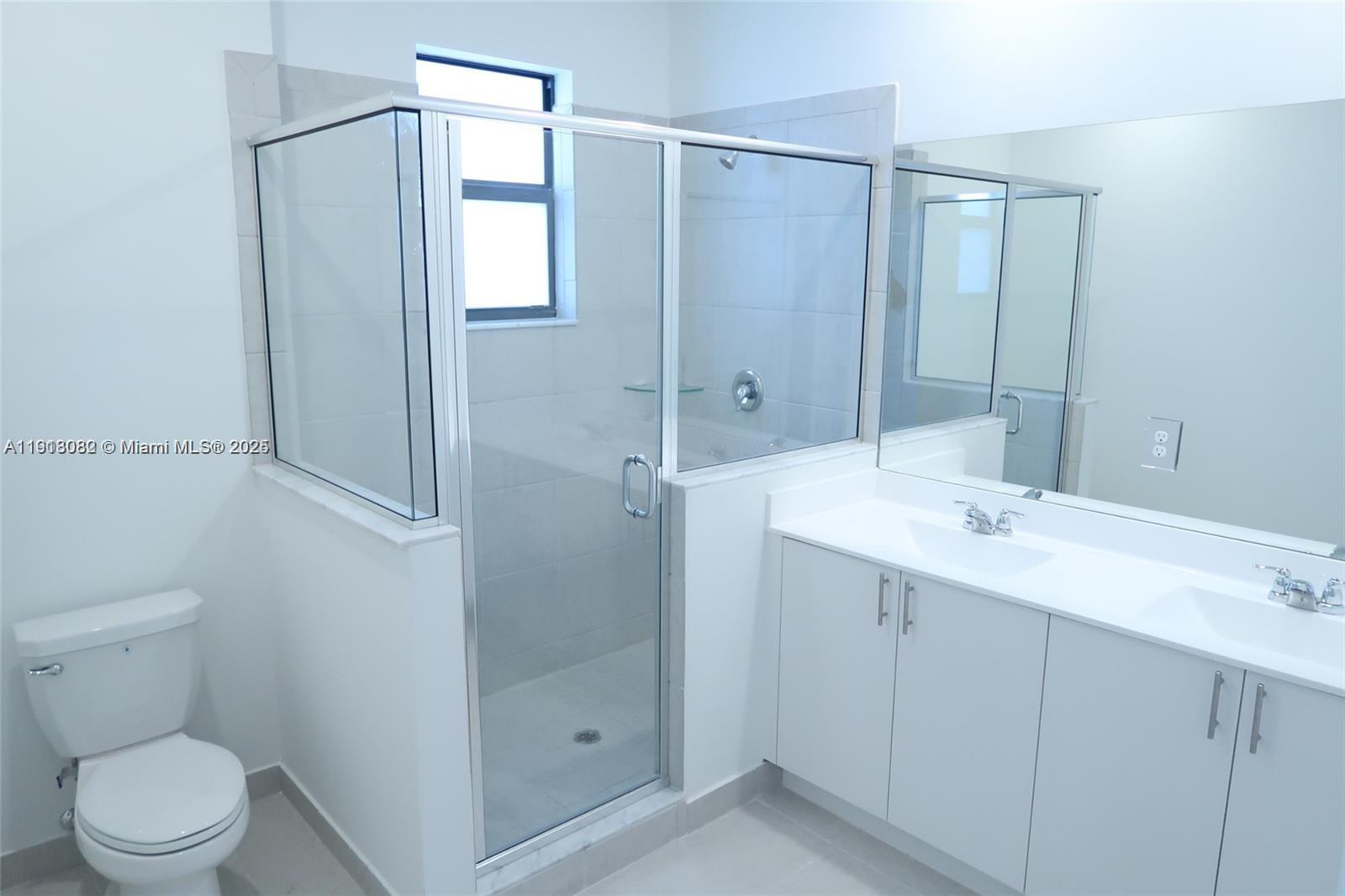 12946 Southwest 231st Street Miami, FL 33170 - Photo 35 of 42 a bathroom with a sink a toilet and shower