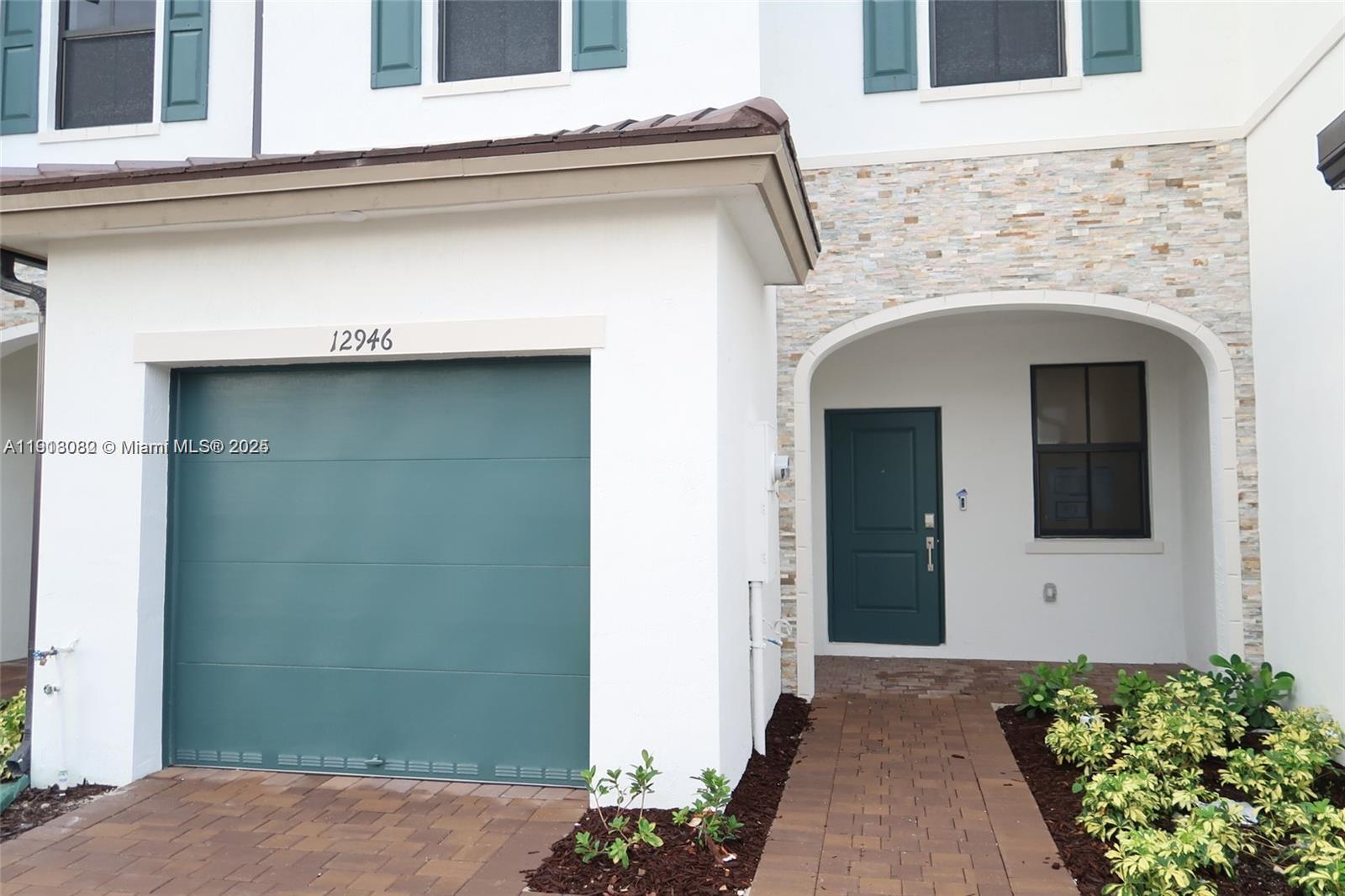 12946 Southwest 231st Street Miami, FL 33170 - Photo 42 of 42 a front view of a house with garage