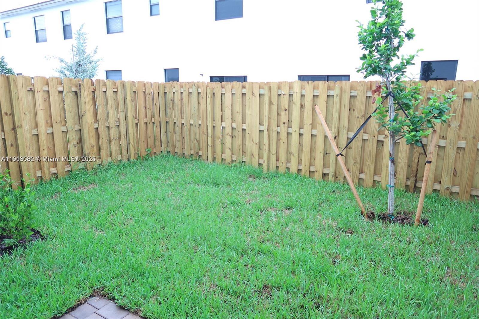 12946 Southwest 231st Street Miami, FL 33170 - Photo 10 of 42 a view of a yard with a fence