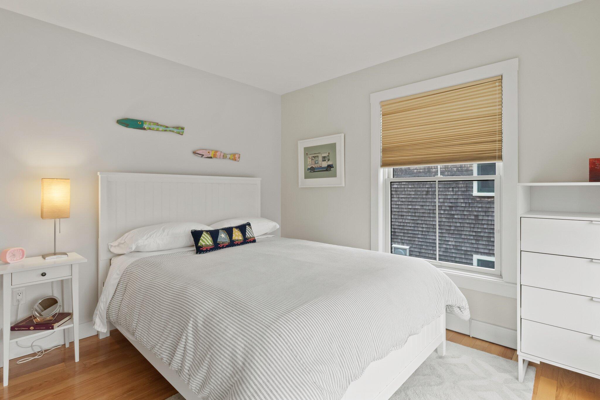 16 Meadow Road, Unit 16 Provincetown, MA 02657 - Photo 14 of 23 a bedroom with a large bed and a window