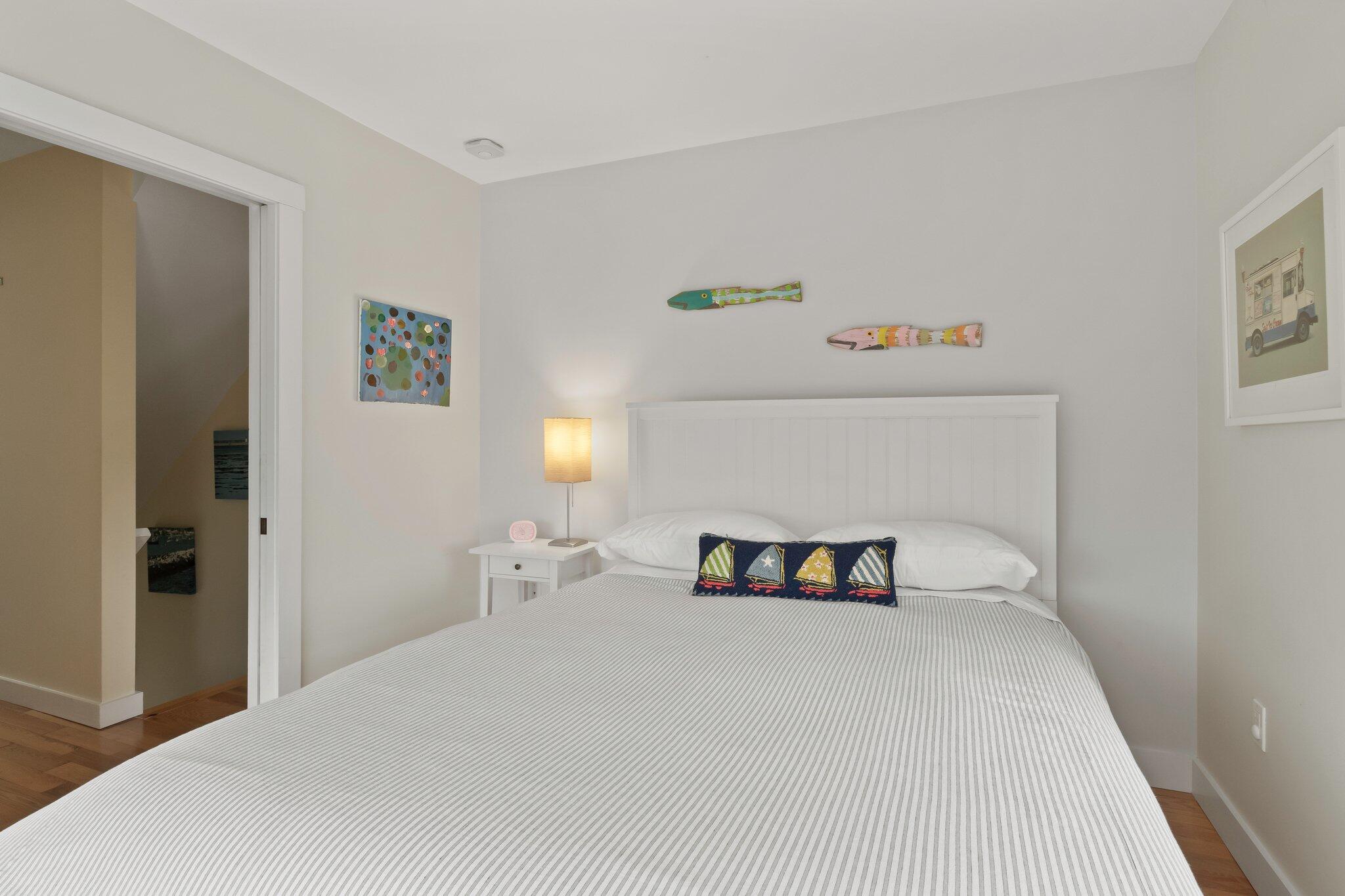 16 Meadow Road, Unit 16 Provincetown, MA 02657 - Photo 15 of 23 a bedroom with a bed and a window