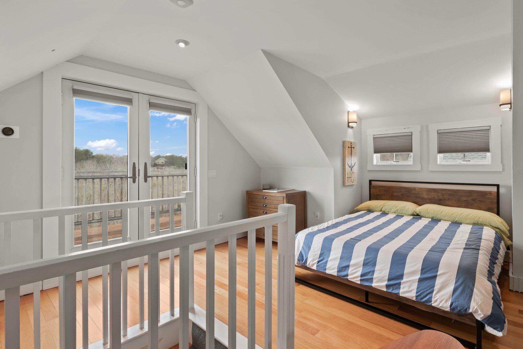 16 Meadow Road, Unit 16 Provincetown, MA 02657 - Photo 17 of 23 a bedroom with furniture and a window