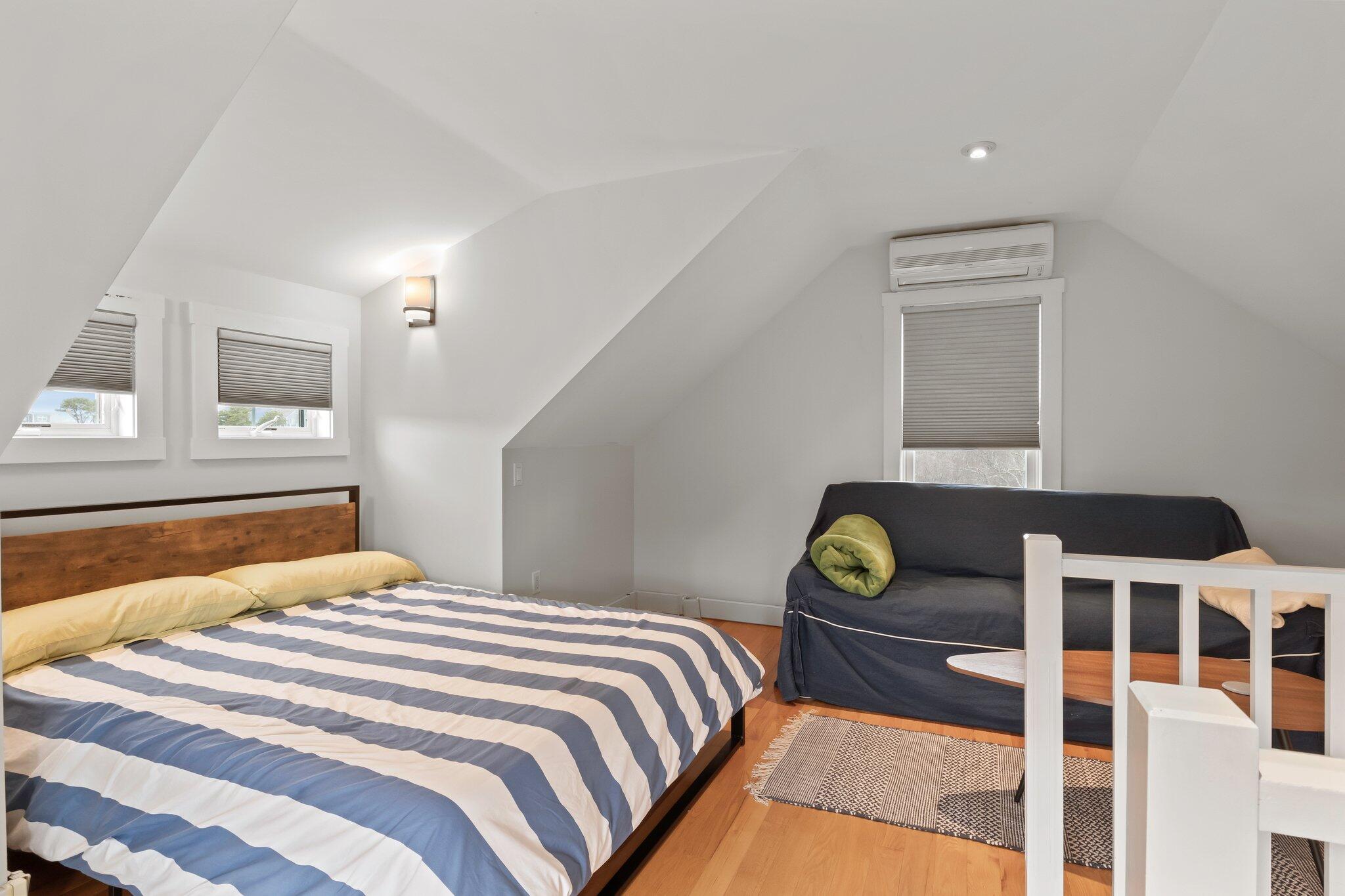 16 Meadow Road, Unit 16 Provincetown, MA 02657 - Photo 18 of 23 a bedroom with a bed and a window