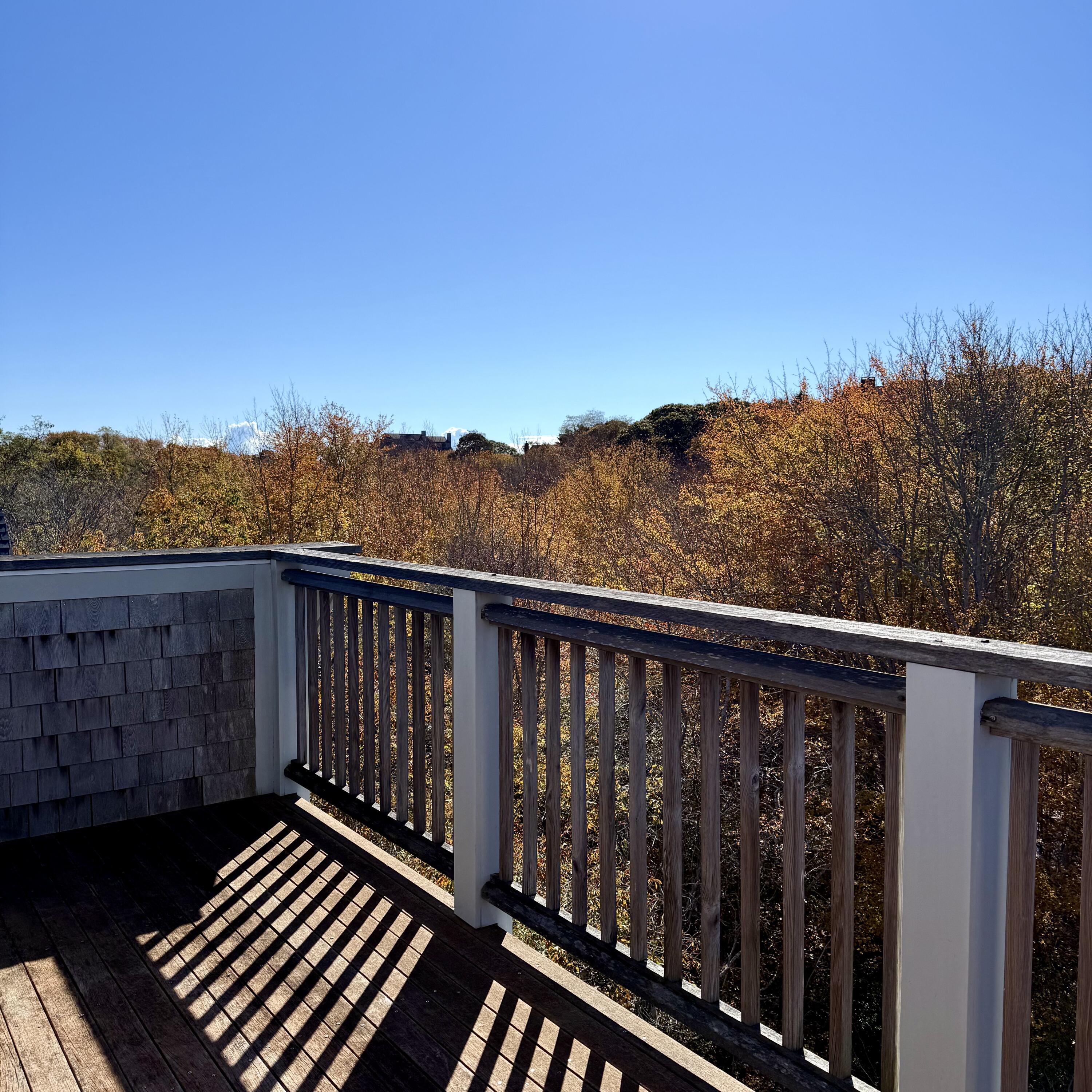 16 Meadow Road, Unit 16 Provincetown, MA 02657 - Photo 19 of 23 a balcony with wooden floor and city view