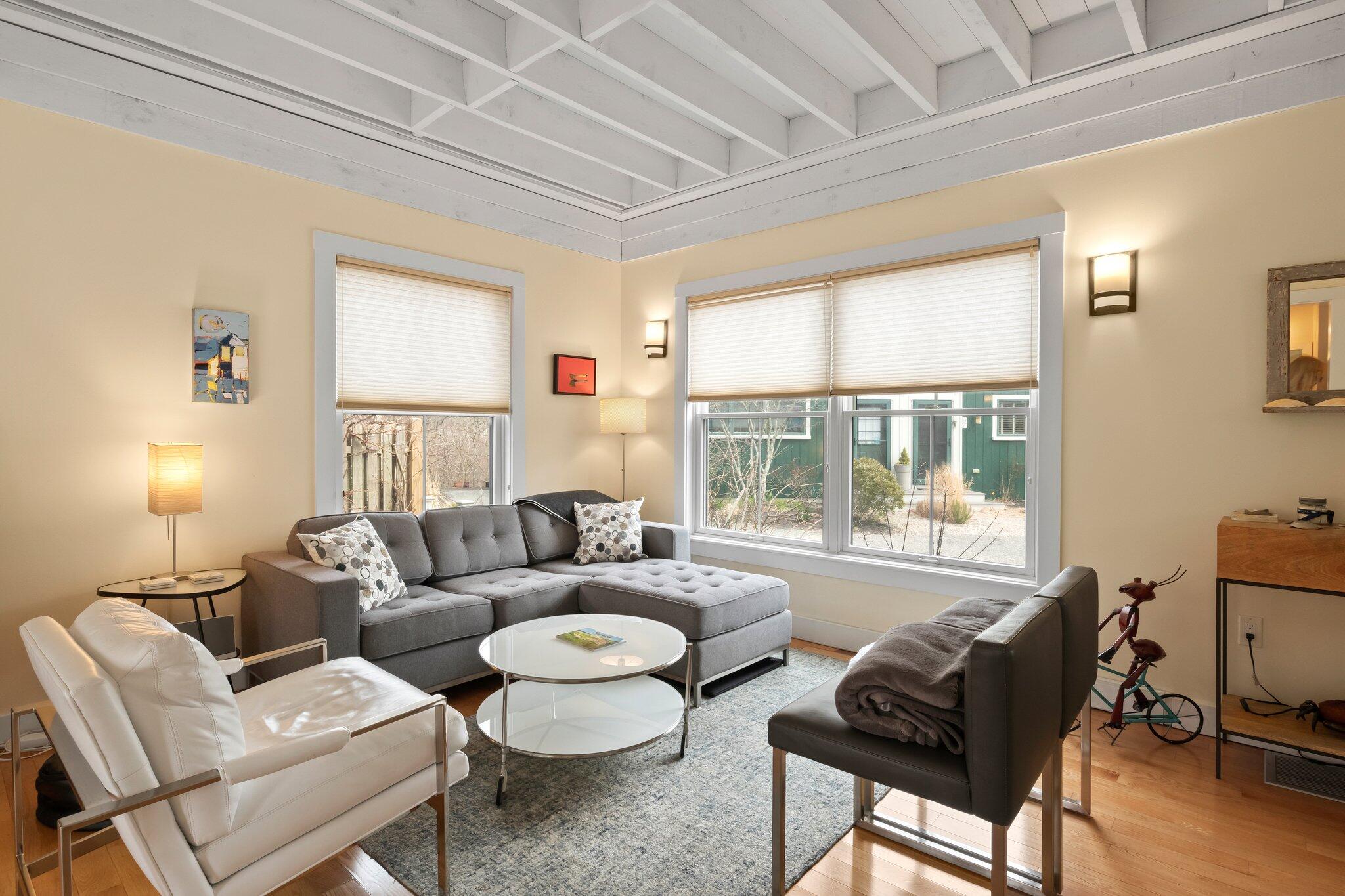 16 Meadow Road, Unit 16 Provincetown, MA 02657 - Photo 3 of 23 a living room with furniture and a large window