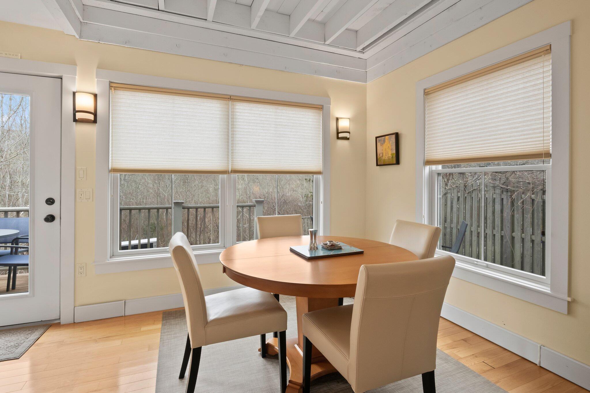 16 Meadow Road, Unit 16 Provincetown, MA 02657 - Photo 4 of 23 a view of a dining room with furniture and wooden floor