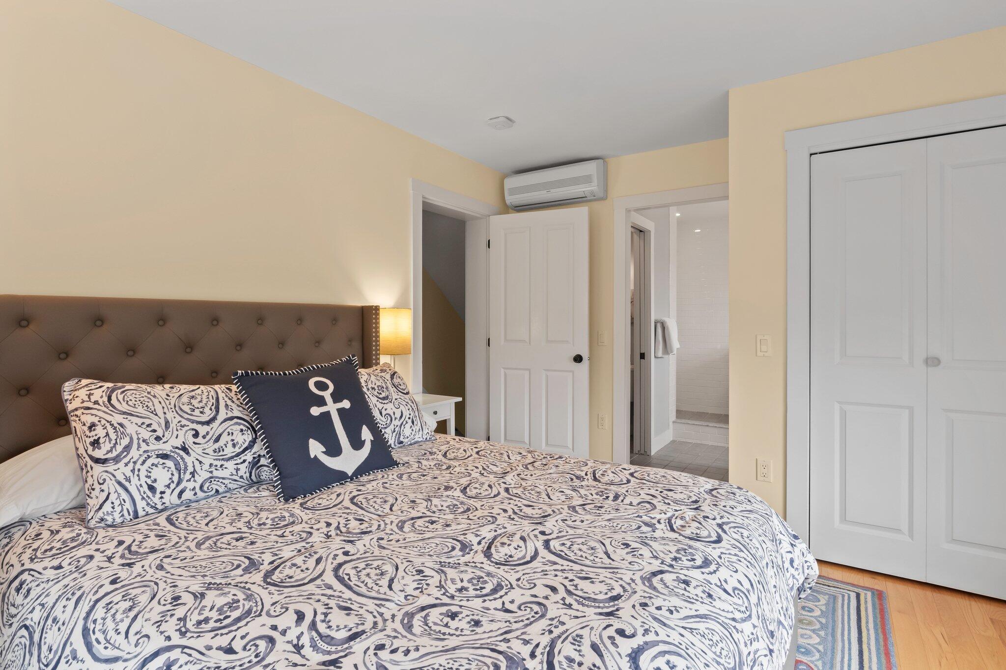 16 Meadow Road, Unit 16 Provincetown, MA 02657 - Photo 10 of 23 a bed room with a bed and a chair