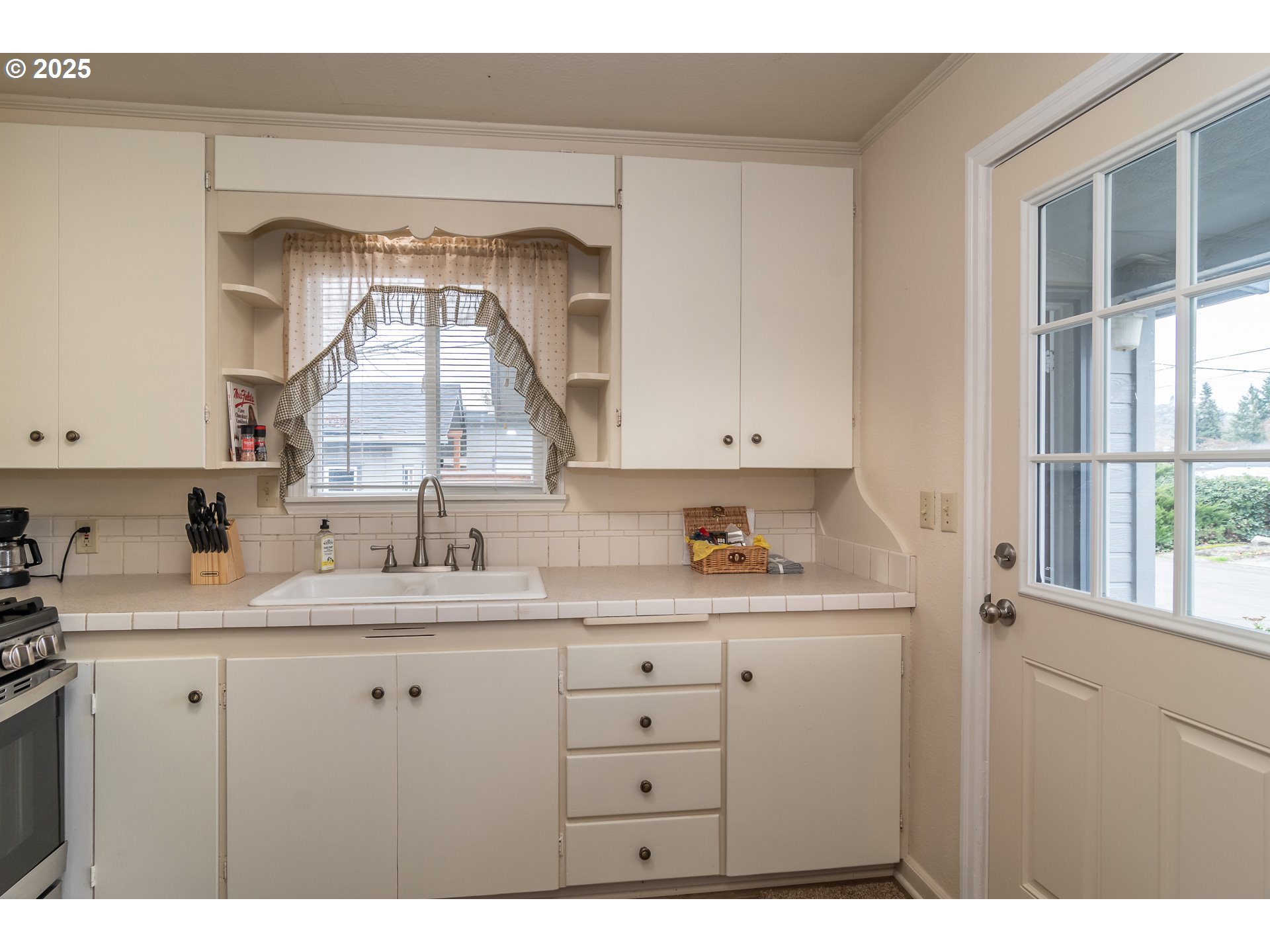 512 West Center Street Roseburg, OR 97471 - Photo 26 of 48 a kitchen with a sink cabinets and a window