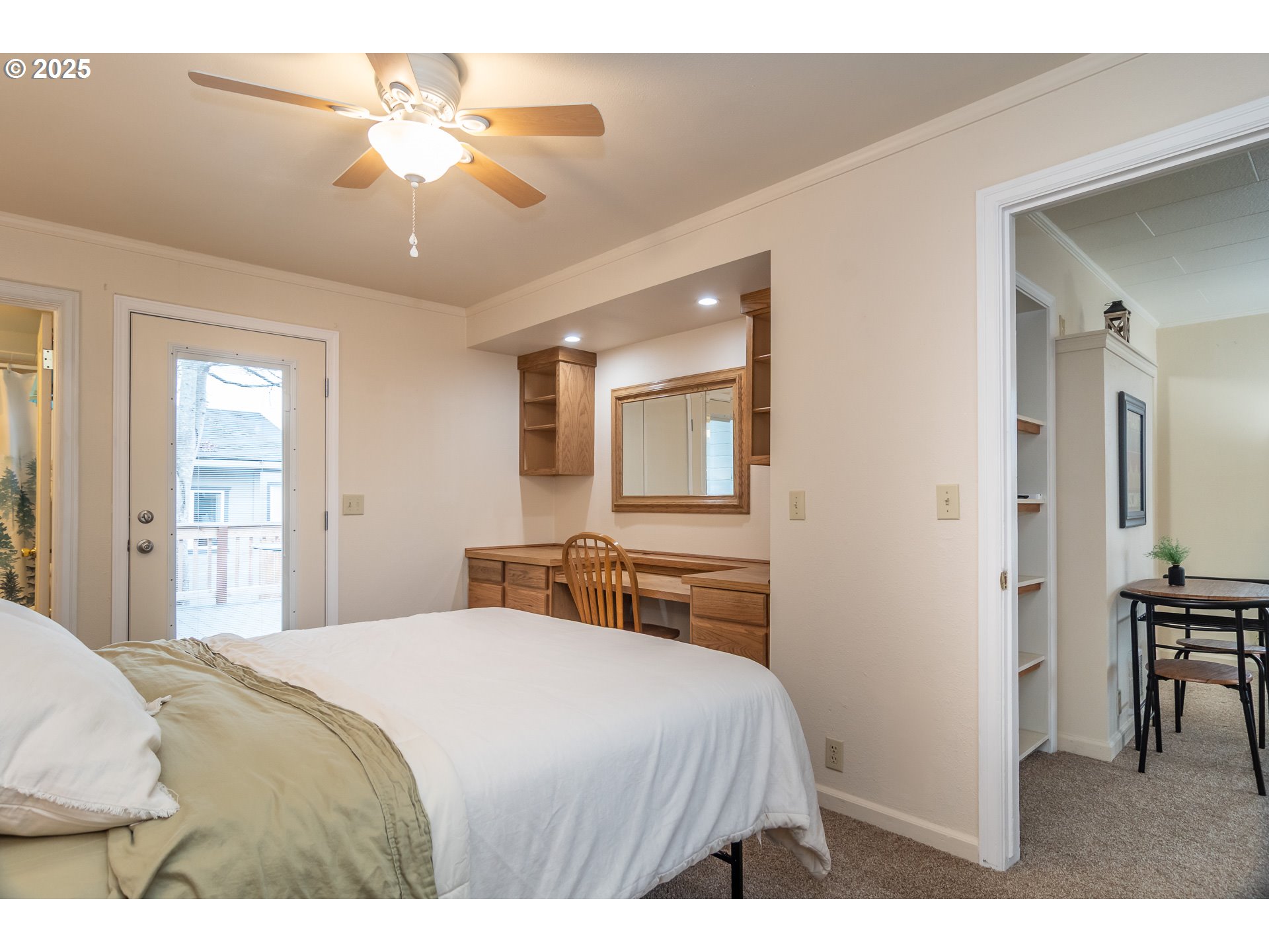 512 West Center Street Roseburg, OR 97471 - Photo 35 of 48 a bedroom with a bed and a chandelier