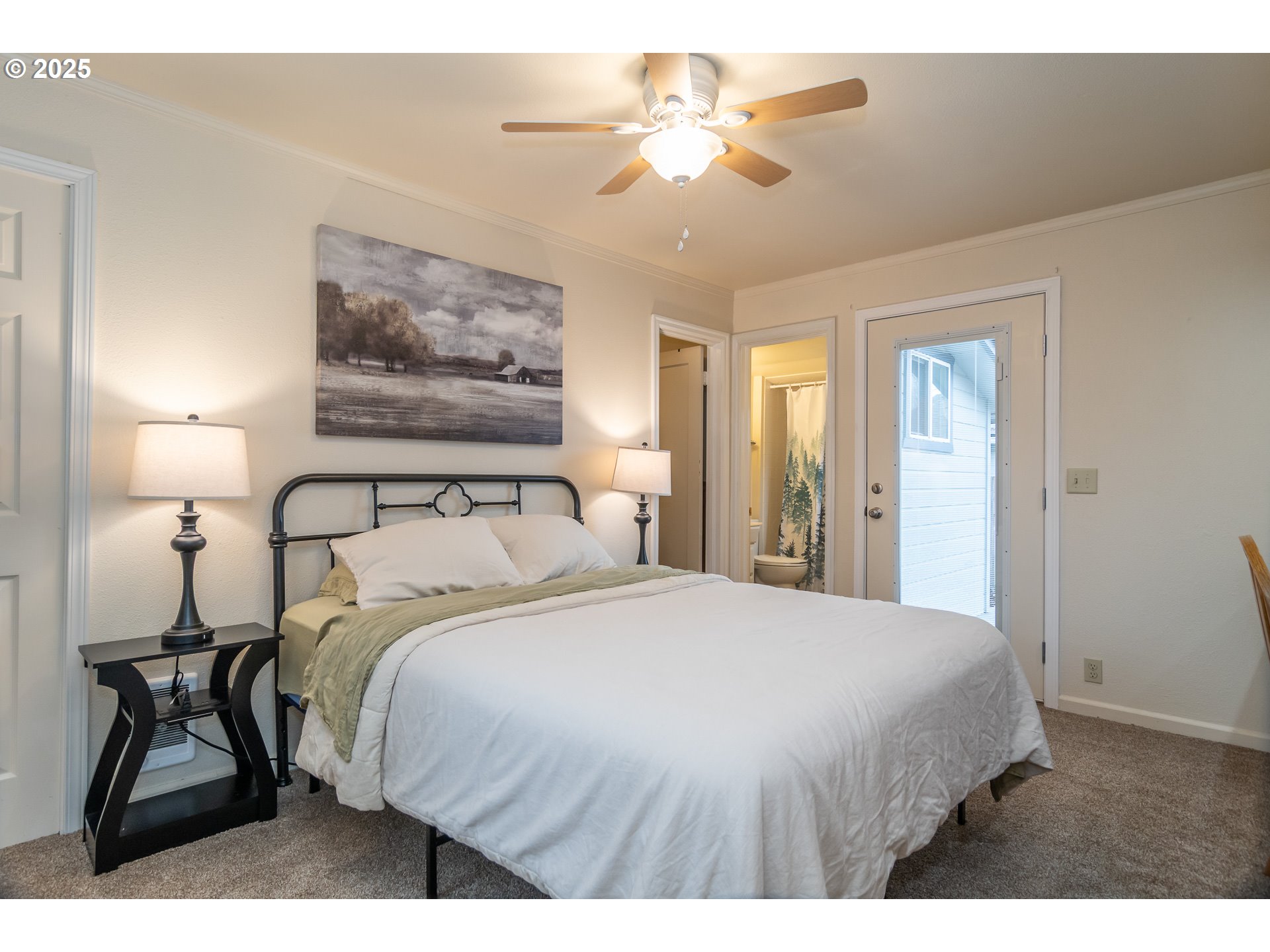 512 West Center Street Roseburg, OR 97471 - Photo 36 of 48 a bedroom with a bed and a chandelier