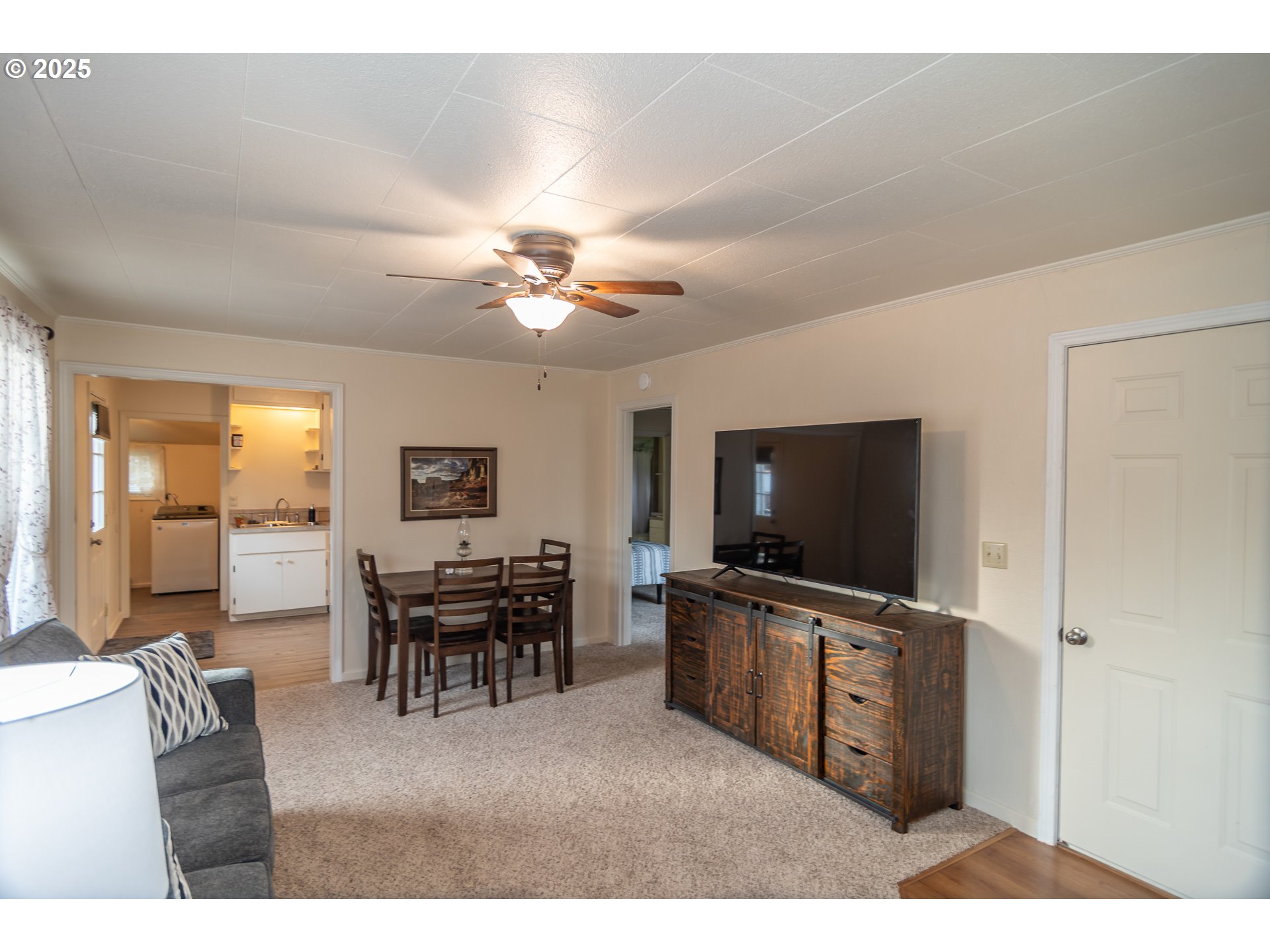 512 West Center Street Roseburg, OR 97471 - Photo 10 of 48 a living room with furniture and a flat screen tv