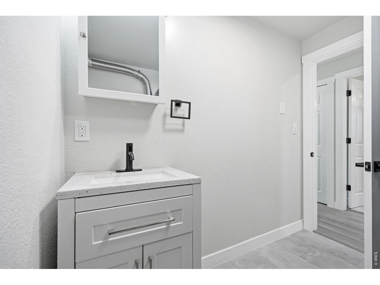 1035 6th Street Berthoud, CO 80513 - Photo 17 of 37 a view of bathroom with cabinet