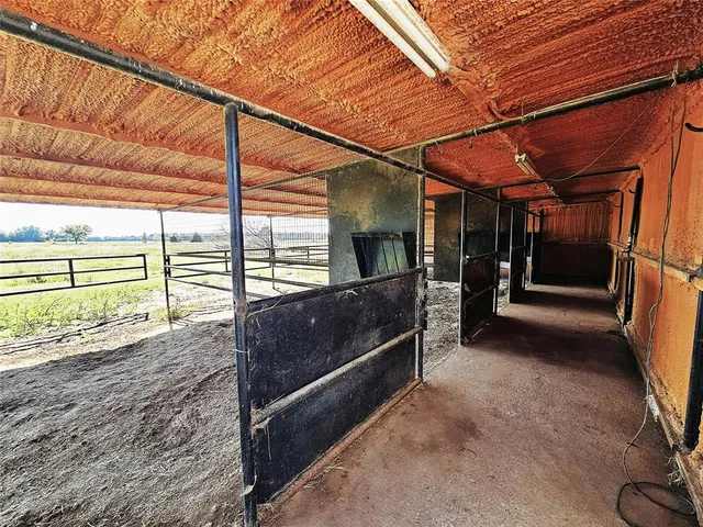 a view of a room with wooden walls