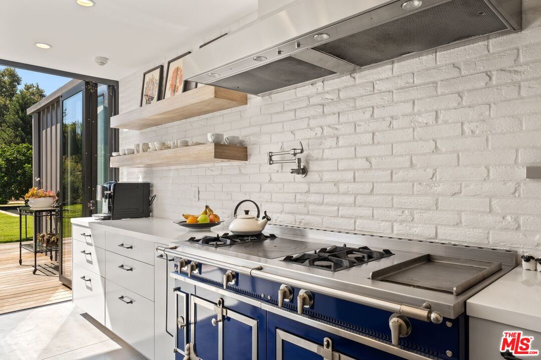 6237 Bonsall Drive Malibu, CA 90265 - Photo 12 of 50 a kitchen with a stove and a cabinets
