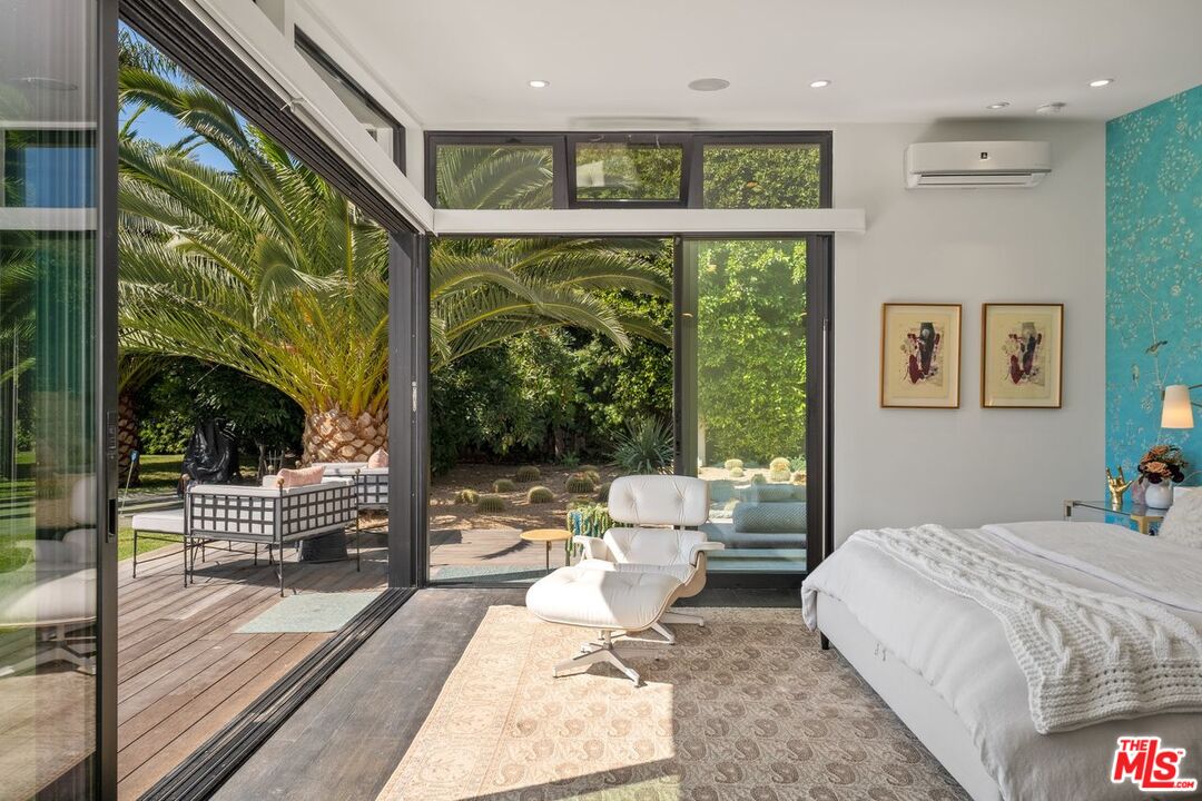 6237 Bonsall Drive Malibu, CA 90265 - Photo 16 of 50 a bedroom with large window and a table