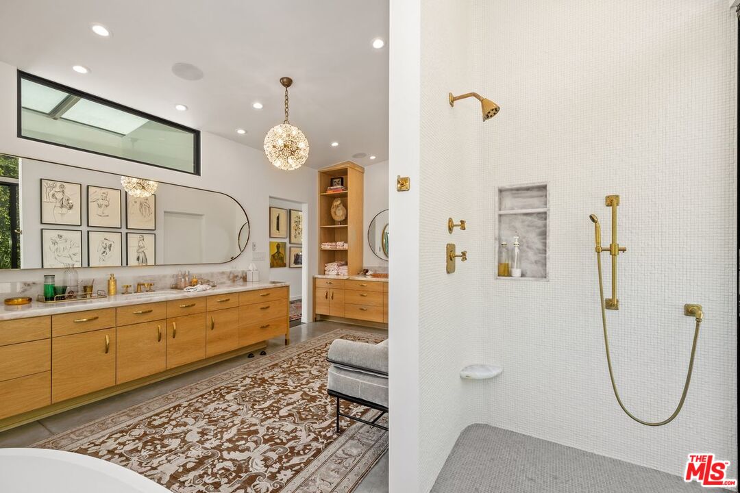 6237 Bonsall Drive Malibu, CA 90265 - Photo 22 of 50 a bathroom with a tub sink and mirror