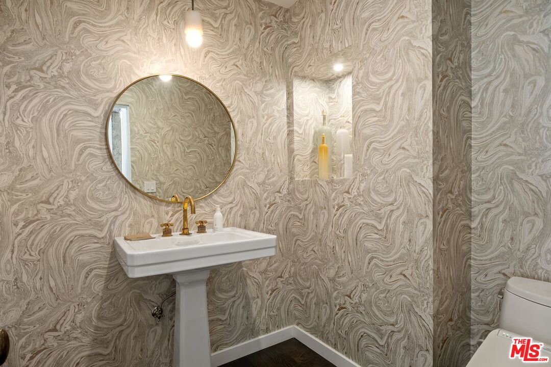 6237 Bonsall Drive Malibu, CA 90265 - Photo 26 of 50 a bathroom with a sink and mirror