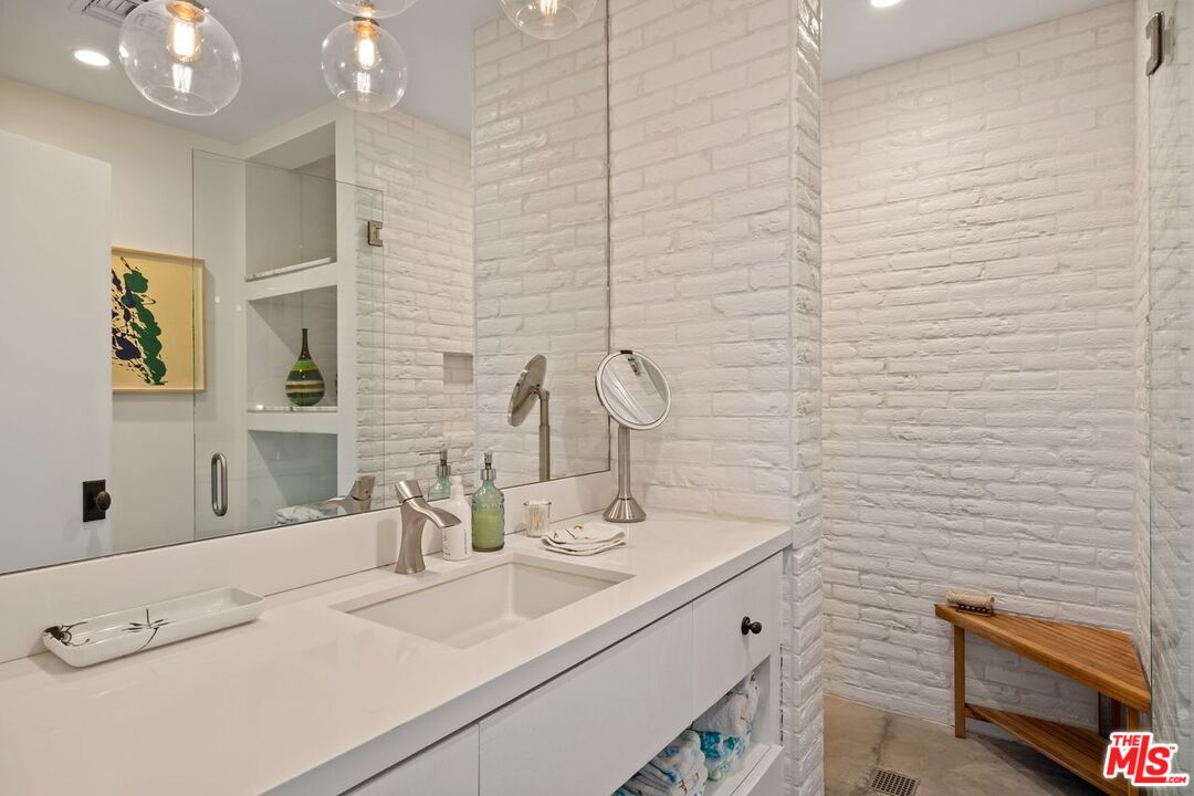6237 Bonsall Drive Malibu, CA 90265 - Photo 28 of 50 a bathroom with a sink a vanity and a mirror