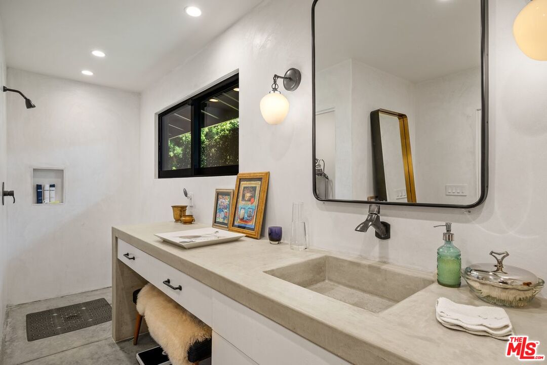 6237 Bonsall Drive Malibu, CA 90265 - Photo 31 of 50 a bathroom with a double vanity sink and a mirror