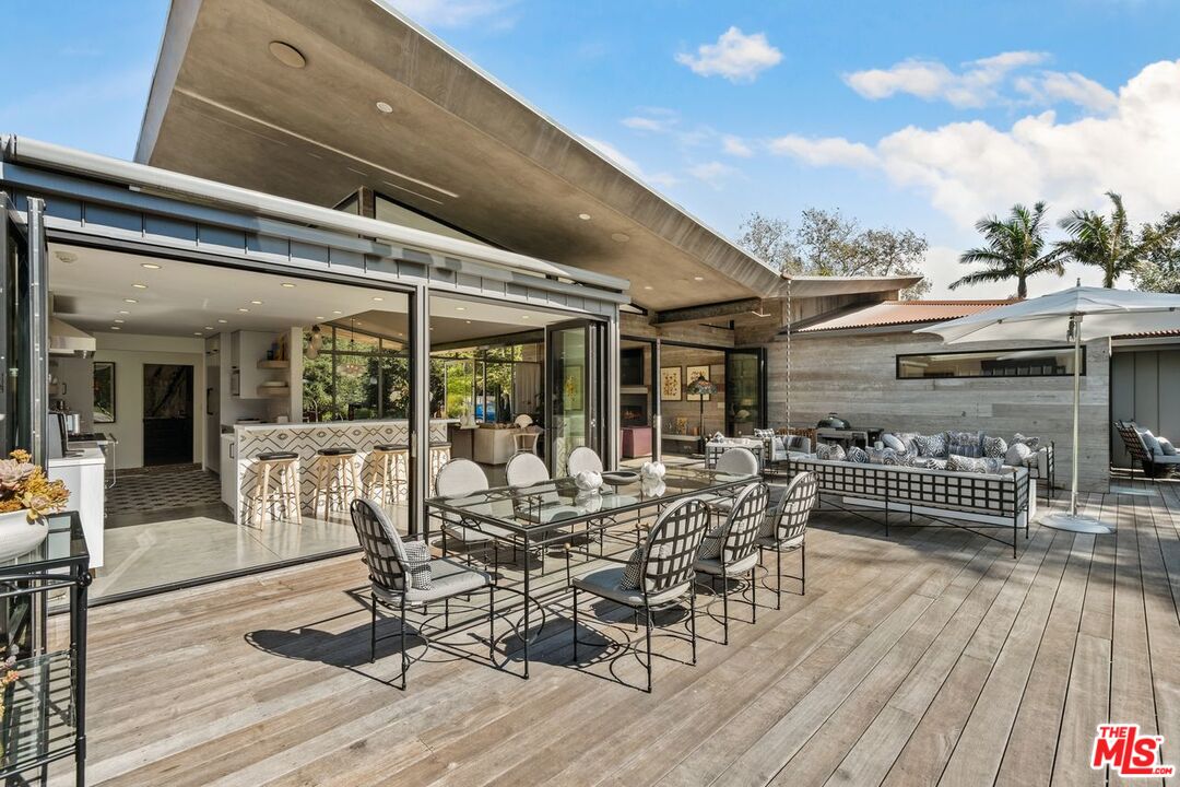 6237 Bonsall Drive Malibu, CA 90265 - Photo 34 of 50 a view of a patio with table and chairs