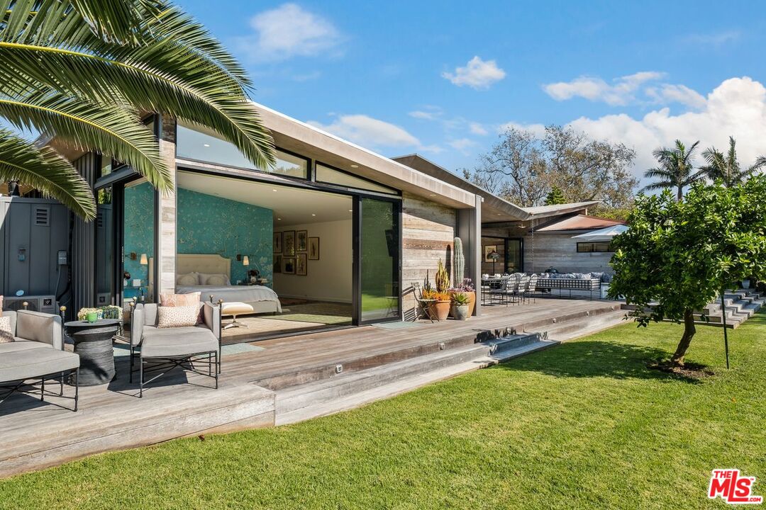 6237 Bonsall Drive Malibu, CA 90265 - Photo 37 of 50 a view of a house with backyard and sitting area
